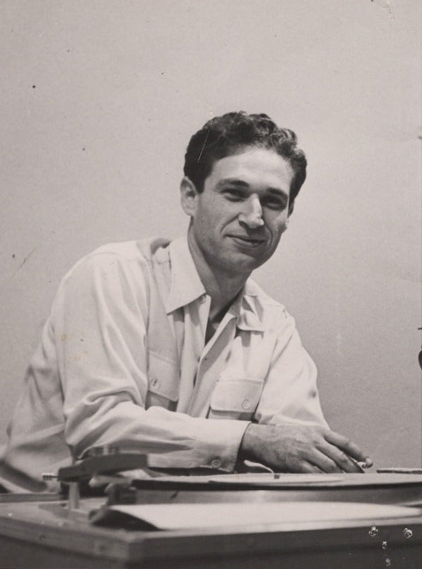 Dave Gold smiling with the record cutting lathe he built for Gold Star